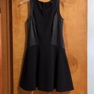 Black tank dress with faux leather sides and trim
